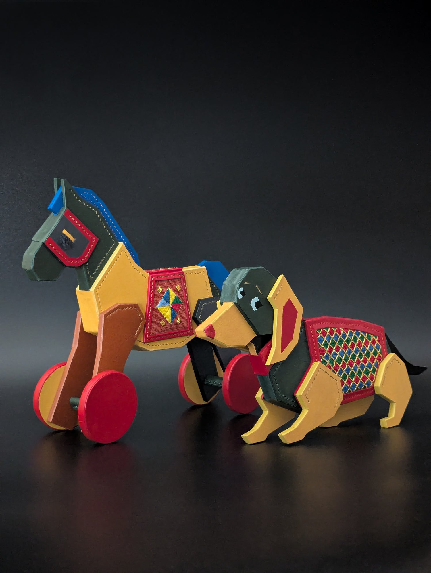 Colorful leather interior toy horse and dog with embroidery  on a dark background